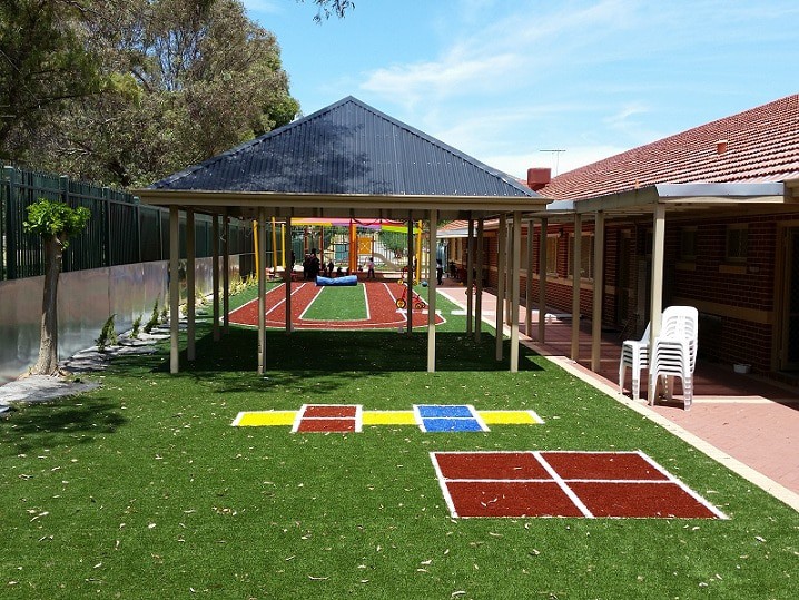 Artificial Grass for Playgrounds - School with artificial turf playground