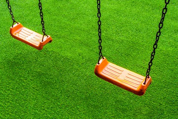 Artificial turf playground with swings