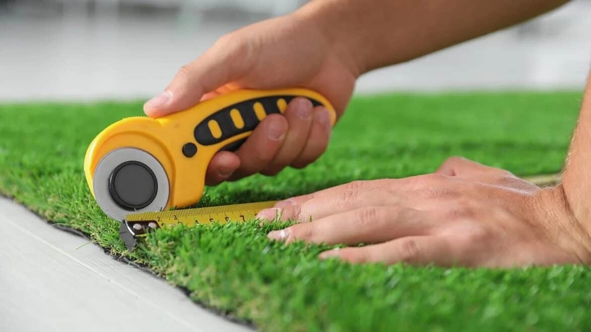 Professional measuring and cutting artificial turf