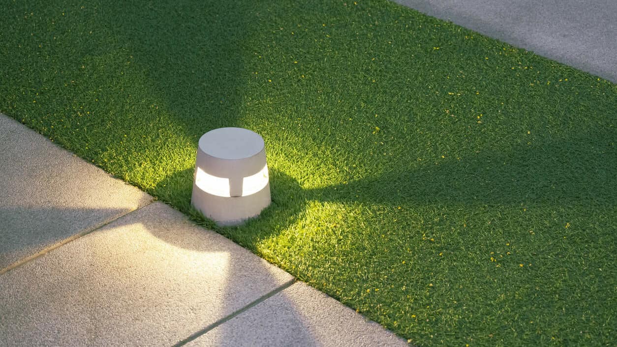 Pavers and artificial turf with light
