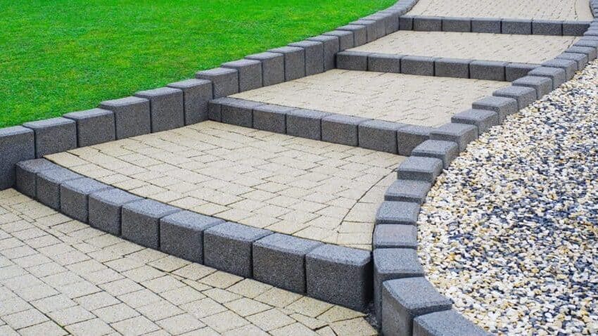 Concrete steps with artificial turf and pebble edging