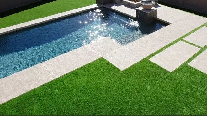 Artificial Turf Poolside by pool and paving