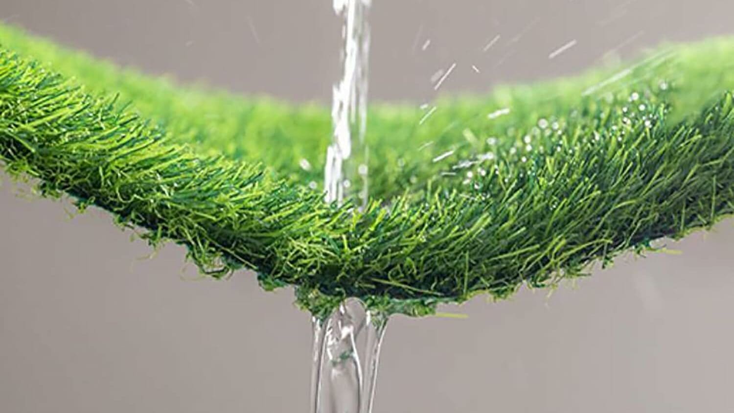 Water poured on artificial turf to show drainage